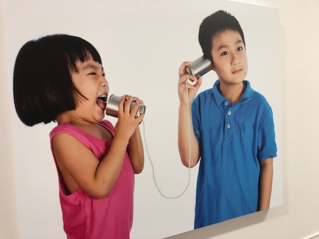 Kids talking on cans